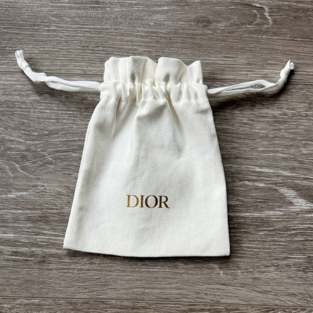 DIOR Cream Drawstring Bag with Gold Logo